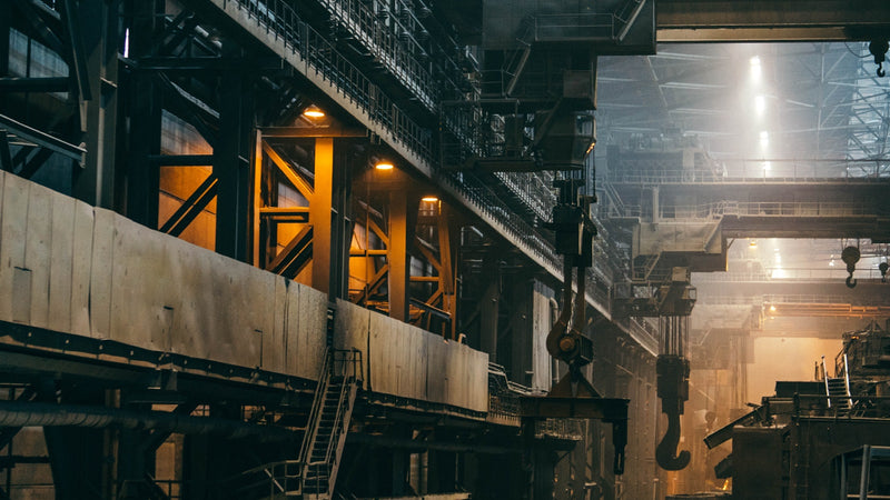 Interior of a large industrial factory. Photo by Ant Rozetsky on Unsplash.
