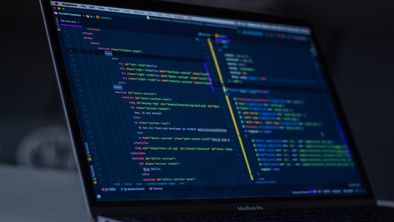 Code in an editor on a MacBook Pro screen. Photo by Arnold Francisca on Unsplash.