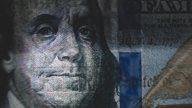 Close-up of a US hundred dollar bill. Photo by Patrick Hendry on Unsplash.