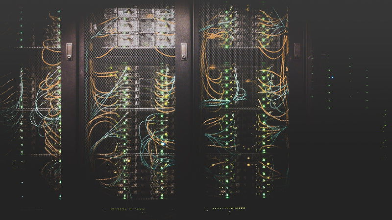 Server rack cabling with status lights. Photo by Taylor Vick on Unsplash.